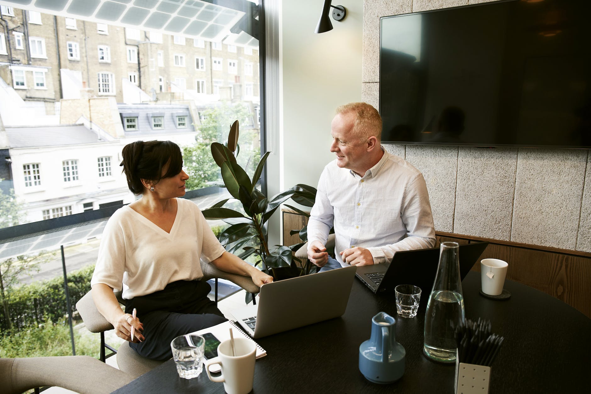 man and woman discussing and sharing ideas